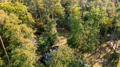 Prodej stavebního pozemku 1 300 m² se srubem, Stará Boleslav – Vestecká.